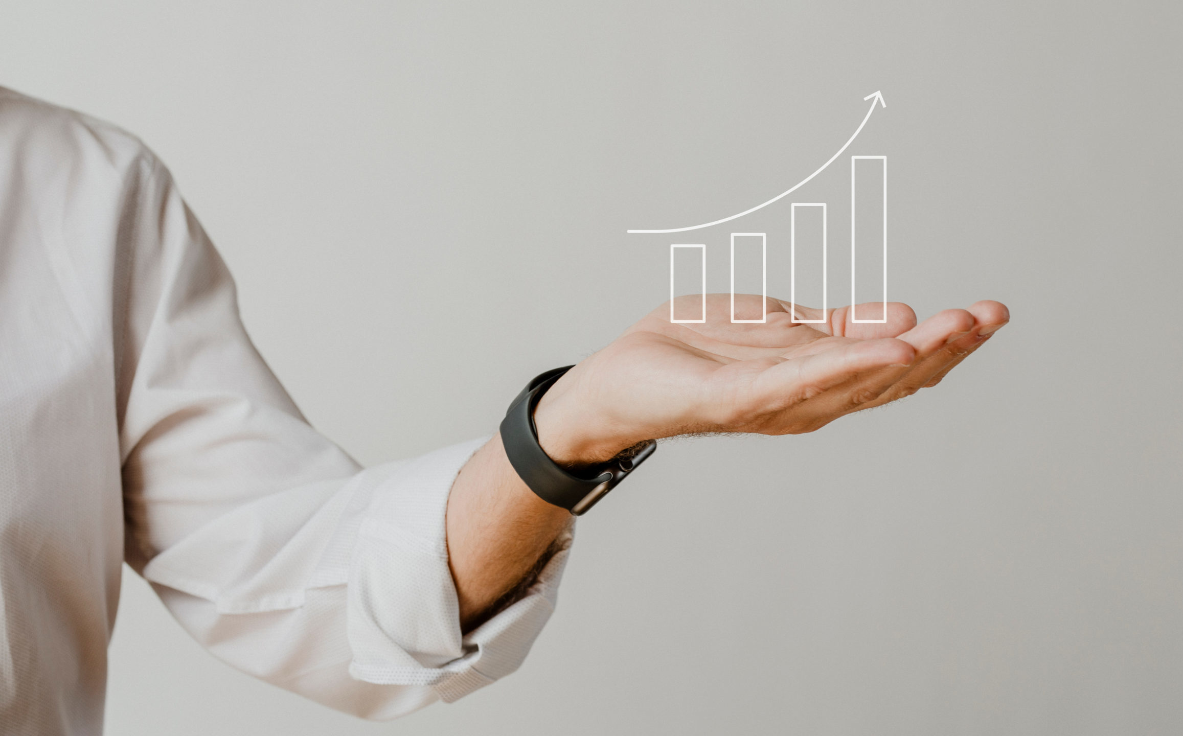 cropped-cropped-digital-increasing-bar-graph-with-businessman-hand-overlay-scaled-1.jpg